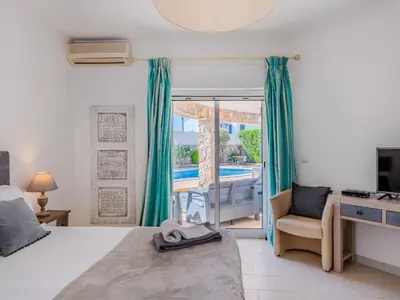 a bathroom with a toilet and a sink and a shower at Holiday Home Paulo - VIP Properties by Interhome in Galé