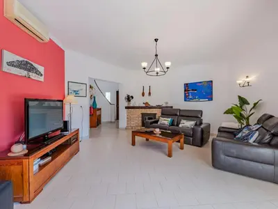 a bedroom with a bed with two pillows on it at Holiday Home Paulo - VIP Properties by Interhome in Galé