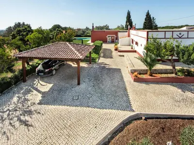 a dining room with a table and chairs at Villa Recanto Murta V6 VIP Properties by Interhome in Azinhal