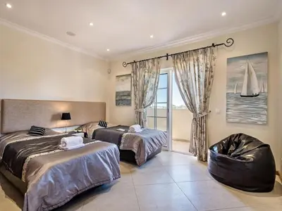 a bathroom with a toilet and a sink and a tub at Villa Monte Sol - VIP Properties by Interhome in Azinhal