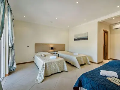 a bathroom with a toilet and a sink at Villa Monte Sol - VIP Properties by Interhome in Azinhal