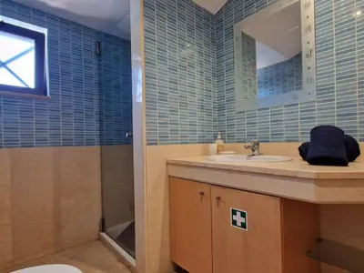 a bathroom with a sink and a mirror at Villa Corcovada Lote 28 VIP Properties by Interhome in Albufeira