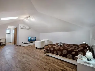 a bedroom with a bed and a flat screen tv at Villa Quinta Valente VIP Properties by Interhome in Silves