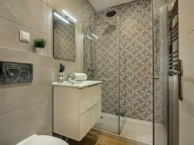 a room with three beds with towels on them at Holiday Home Cristal VIP Properties by Interhome in Albufeira