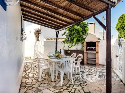 a room with three bunk beds with blue walls at Holiday Home Safira - VIP Properties by Interhome in Albufeira