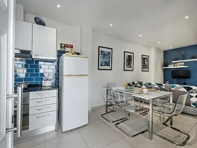 a living room with a couch and a table at Holiday Home Safira - VIP Properties by Interhome in Albufeira