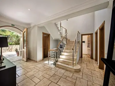 a home with a staircase and aoyer with a stair case at Amazing Algarve Villa 5 Bedrooms Villa Lillian Private Pool & Ping Pong in Almancil
