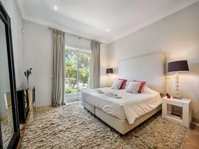 a bedroom with a large bed and a large window at Amazing Algarve Villa 5 Bedrooms Villa Lillian Private Pool & Ping Pong in Almancil