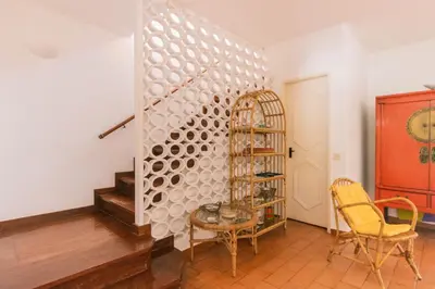 a room with a table and chairs and a wall at AL - Aldeia do Golfe Retreat in Vilamoura