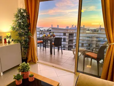 a room with a balcony with a table and a view at AlbufeiraOrada Cozy&Sunny Condo by BeCherish in Albufeira