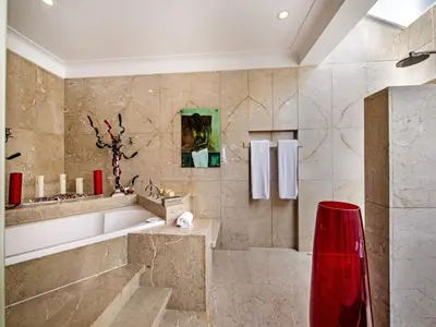 a large bathroom with a tub and a sink at Outstanding Algarve Villa 8 Bedrooms Villa Agua Grande Deluxe Seaviews in Albufeira