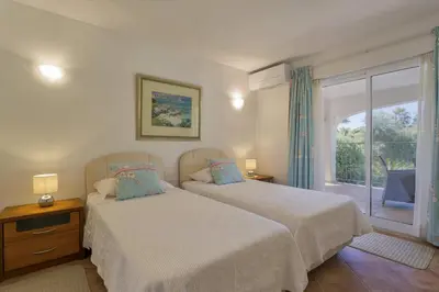 two beds in a bedroom with a balcony at Extravagant Vale Do Lobo Villa 5 Bedrooms Villa Bispo Deluxe Great Pool in Almancil
