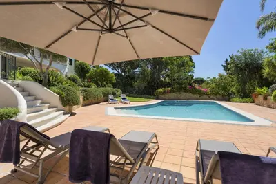 a living room with a couch and a table at Extravagant Vale Do Lobo Villa 5 Bedrooms Villa Bispo Deluxe Great Pool in Almancil