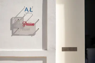 a white door with a sign on it at Casa Passion in Faro