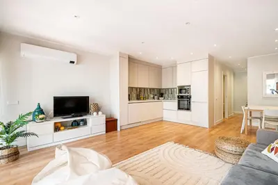 a large living room with a couch and a table at BeGuest Falésia Beach & Barbecue Apartment in Albufeira