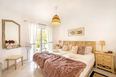 a bedroom with a large bed and a window at BeGuest Balaia Apartment 137 in Albufeira
