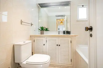 a bathroom with a toilet and a sink and a tub at BeGuest Balaia Apartment 137 in Albufeira
