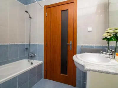 a bathroom with a sink and a bath tub and a sink at Globe 33 Apartment by Stay ici Algarve Holiday Rental in Albufeira