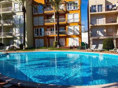 a large swimming pool in front of a building at Globe 33 Apartment by Stay ici Algarve Holiday Rental in Albufeira