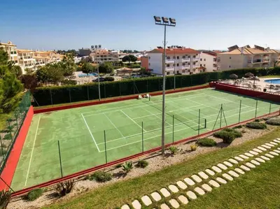 an overhead view of a tennis court at View Waves Apartment by Stay ici Algarve Holiday Rental in Albufeira