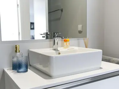 a bathroom with a white sink and a mirror at Panoramic E Apartment by Stay ici Algarve Holiday Rental in Albufeira