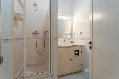 a bathroom with a shower and a sink at Cozy 2 BDR W/Balcony in Vale do Lobo by LovelyStay in Vale do Lobo