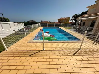a water park with a blue water slide at Villa Belavista - Moradia para Famílias in Albufeira