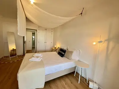 a bedroom with a white bed with a canopy at Vilamoura Marina Charming With Pool by Homing in Vilamoura