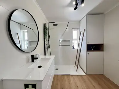 a white bathroom with a mirror and a sink at Vilamoura Marina Charming With Pool by Homing in Vilamoura