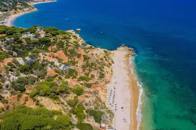 a kitchen with a sink and a white refrigerator at Collection beach side - Albufeira Oura praia 200 meters in Albufeira