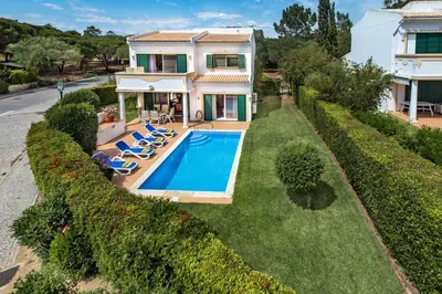 an aerial view of a house with a swimming pool at Mng Elliott50 in Vale do Lobo