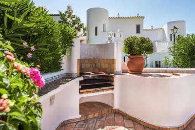 a view from the balcony of a house with flowers at Mng Elliott25 in Vale do Lobo