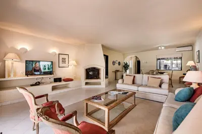 a living room with a couch and a table at Mng Elliott25 in Vale do Lobo