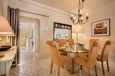 a dining room with a table and chairs at Mng Elliott76 in Vale do Lobo