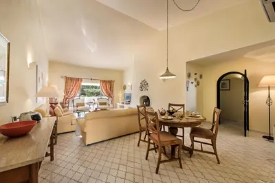 a living room with a couch and a table at Mng Elliott74 in Vale do Lobo