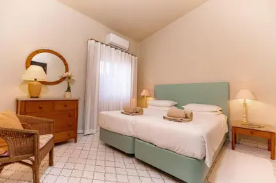a bathroom with a toilet and a sink and a shower at Mng Elliott72 in Vale do Lobo