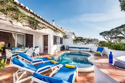 an image of a villa with a swimming pool and a yard at Mng Elliott72 in Vale do Lobo