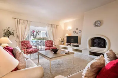 a living room with a couch and a table at Mng Elliott71 in Vale do Lobo