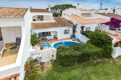 an aerial view of a house with a swimming pool at Mng Elliott53 in Vale do Lobo
