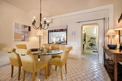 a dining room with a table and chairs at Mng Elliott53 in Vale do Lobo