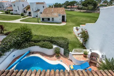 an aerial view of a house with a swimming pool at Mng Elliott53 in Vale do Lobo