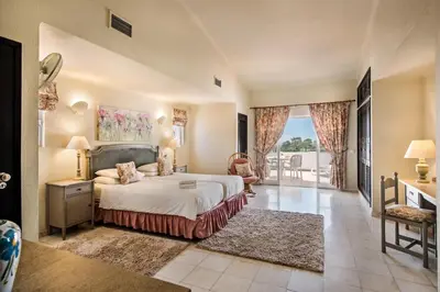 a villa with a swimming pool in front of a house at Mng Elliott51 in Vale do Lobo