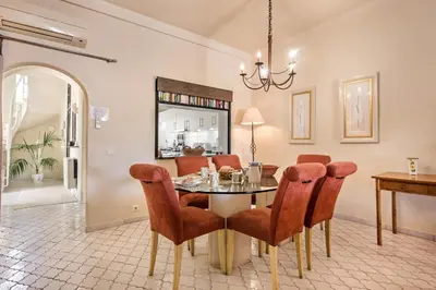 a dining room with a table and chairs at Mng Elliott37 in Vale do Lobo