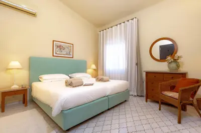 a bedroom with a large bed and a window at Mng Elliott37 in Vale do Lobo
