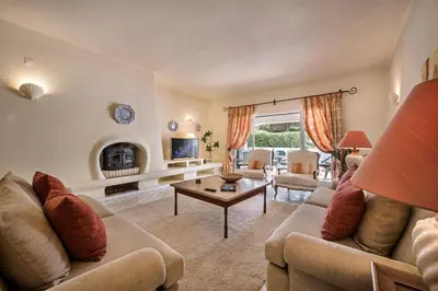 a living room with a couch and a table at Mng Elliott46 in Vale do Lobo