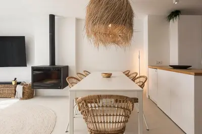a dining room with a white table and chairs at Modern retreat 3 Bedroom in Vilamoura in Quarteira