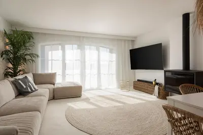 a living room with a couch and a flat screen tv at Modern retreat 3 Bedroom in Vilamoura in Quarteira