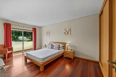 a bedroom with a bed and a window at Tranquil Hideaway Olhos de Agua in Faro