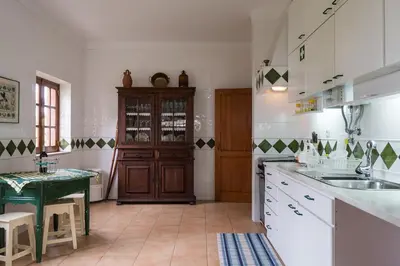 a kitchen with a sink and a counter top at Akisol Faro Relax in Faro
