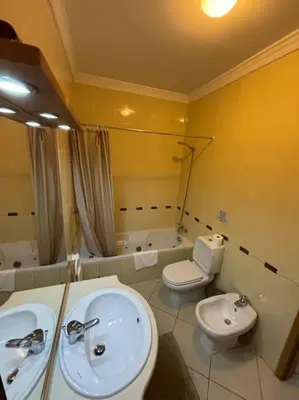 a bathroom with a sink and a toilet and a tub at Apartment Blue Sun in Albufeira